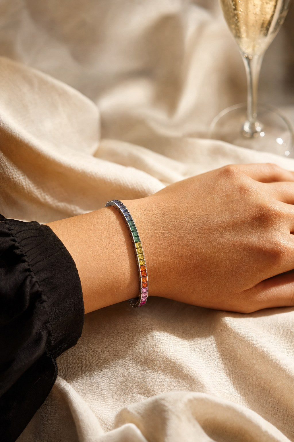 Rainbow sapphire tennis bracelet on the wrist