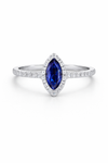 Ring with a blue sapphire and diamond-studded band marquise cut
