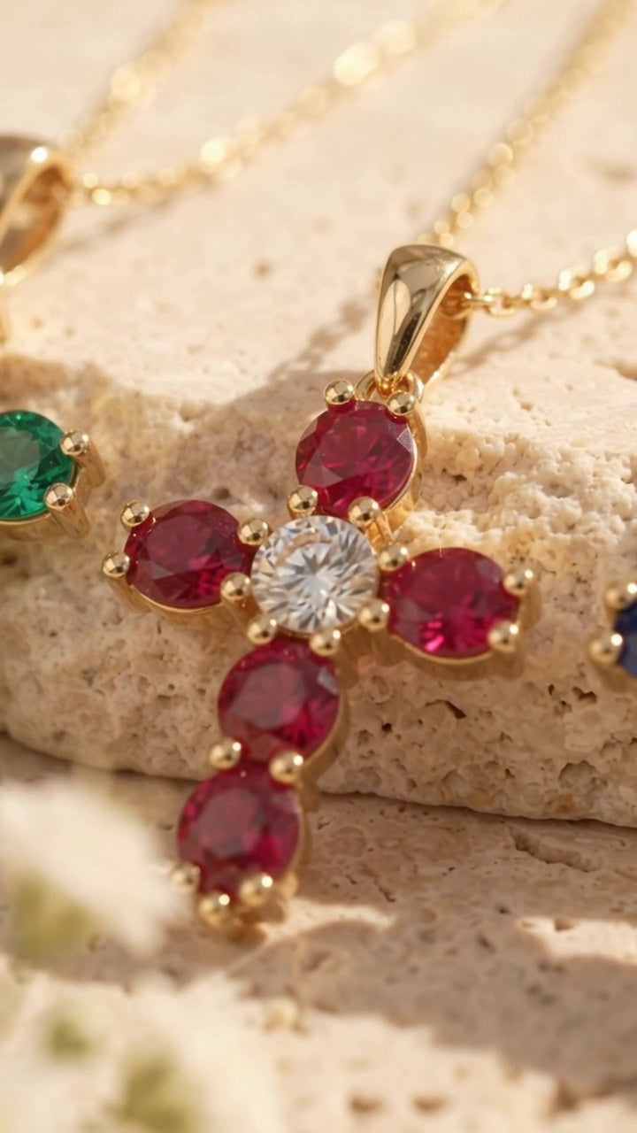 The Faith Cross in ruby, macro detail of the center stone and 14K gold prongs