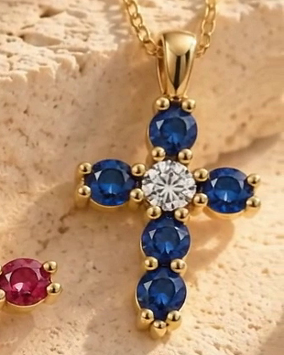 The Faith Cross in sapphire and 14K yellow gold